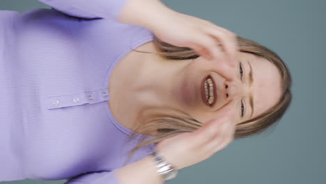 Vertical-video-of-Woman-having-a-nervous-breakdown-in-front-of-the-camera.